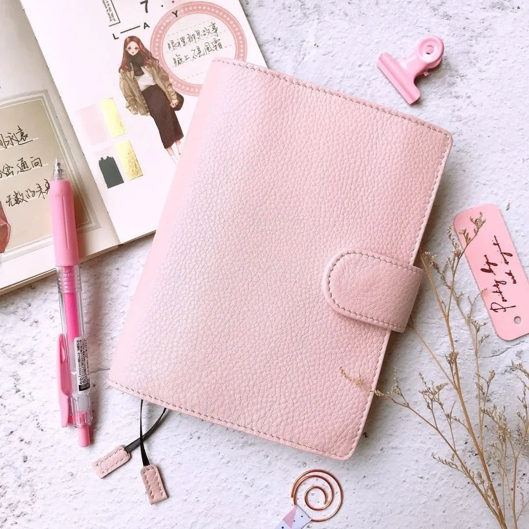 A6 loose-leaf diary with cowhide leather cover showing lychee pattern texture