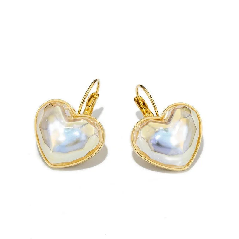 A pair of gold coloured alloy clip-on ear clip earrings for women.