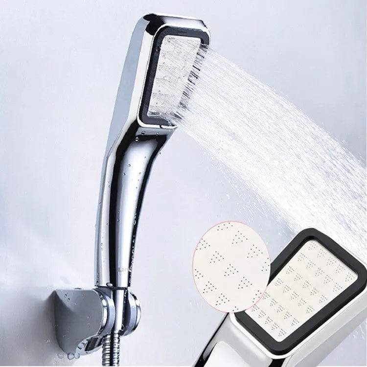 Orange hand-held pressurised shower head with rain spray function