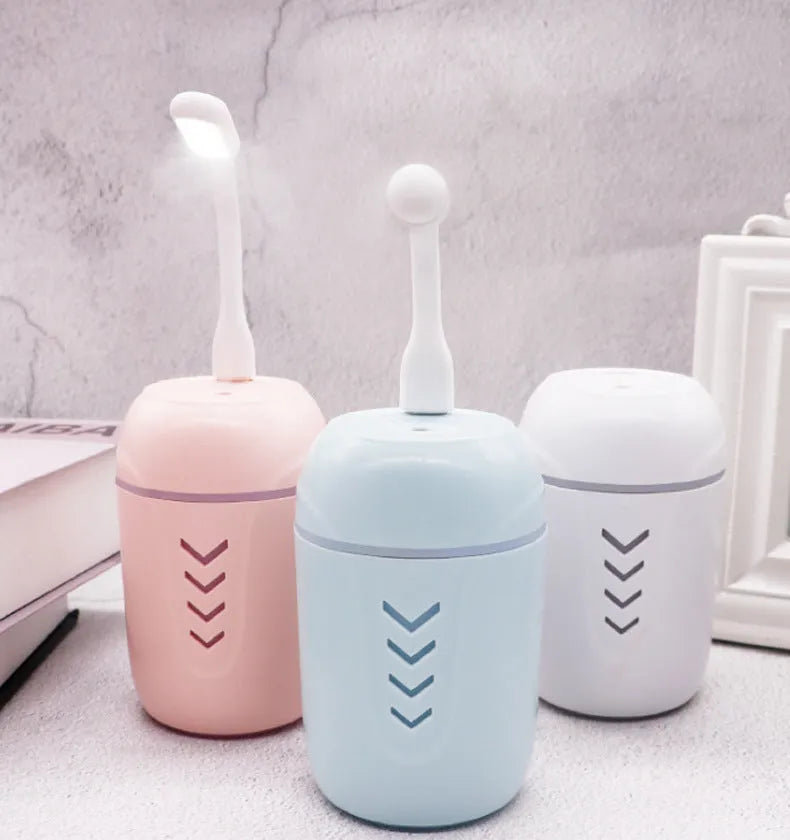 X3 portable car humidifier in blue, pink, or white with 200ml tank and USB/AC power