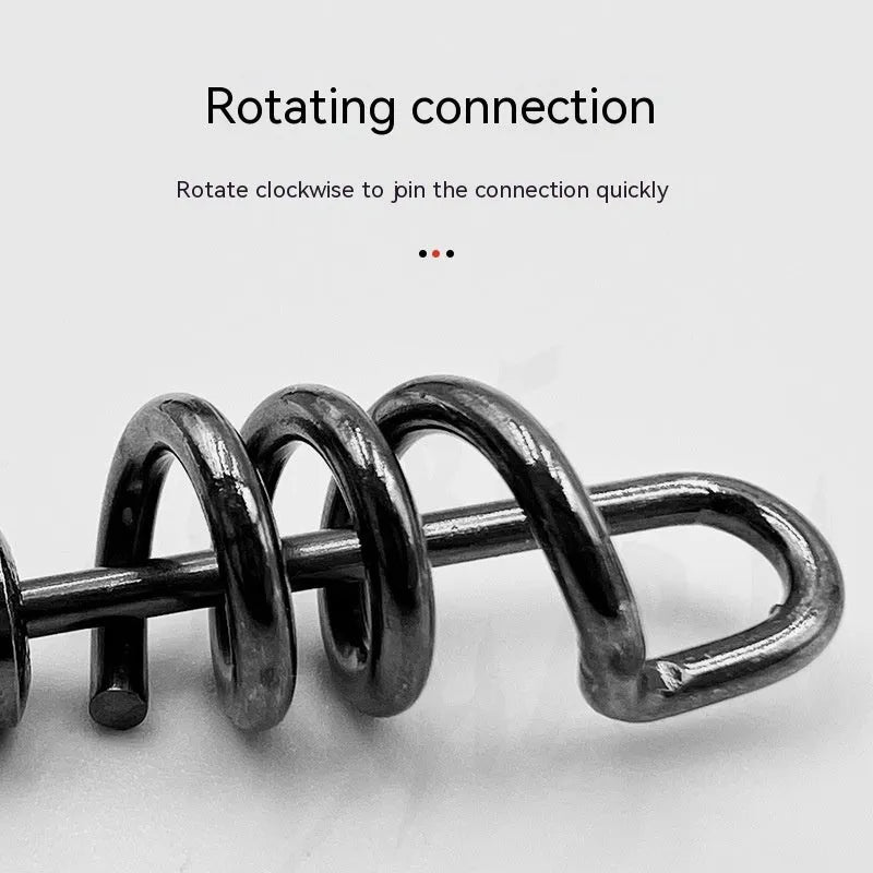Close-up of a silver 8-shaped metal fishing swivel connector on a dark background.