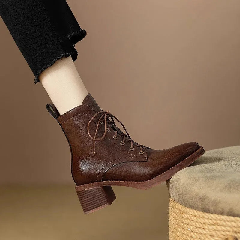 Women's black pointed-toe short boots with a 5.5cm heel and velvet finish on a neutral background.