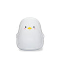 Soft white silicone penguin-shaped rechargeable night light on a surface.
