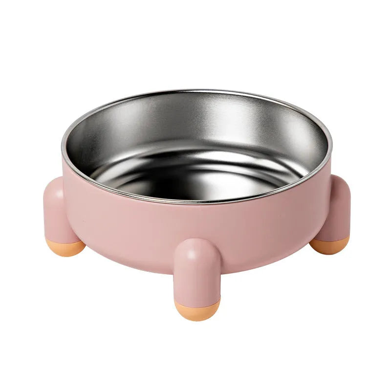 Green non-slip stainless steel pet bowl with high foot base on a floor.