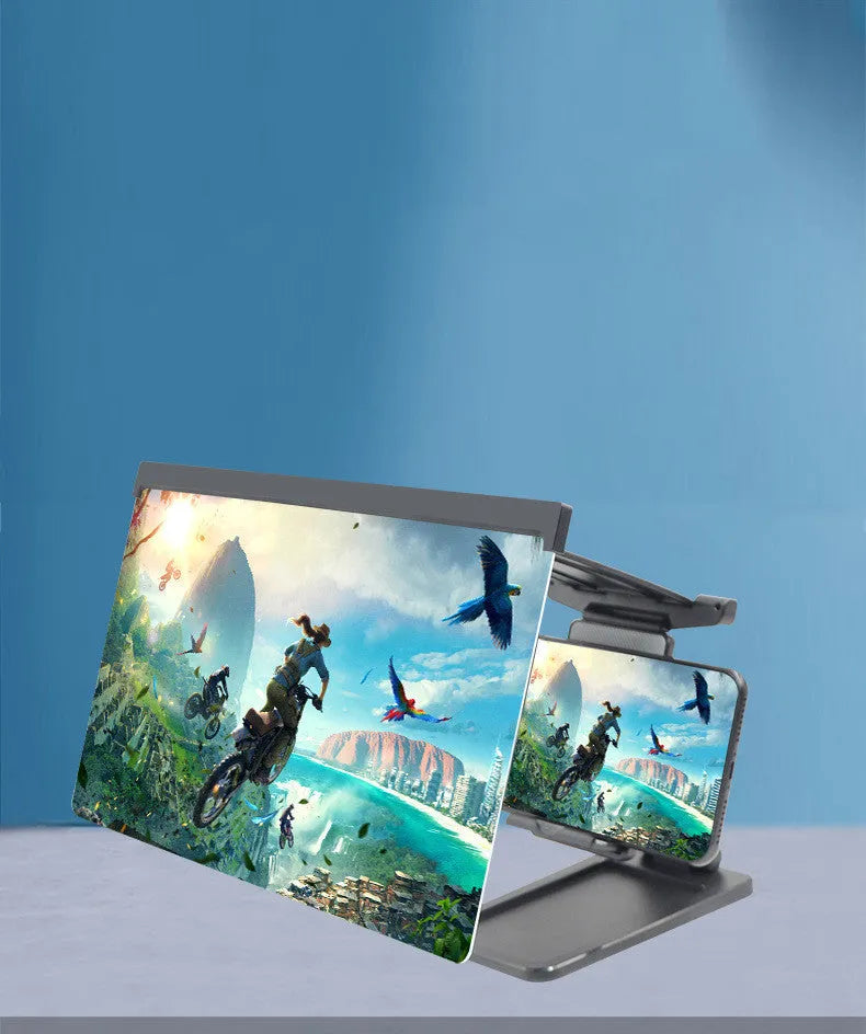 Black folding mobile phone screen magnifier and detachable phone holder on a desk.