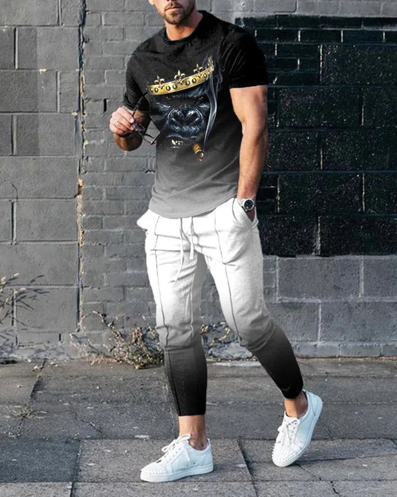 Men's thin short-sleeve printed pullover and matching trousers tracksuit set on a hanger.