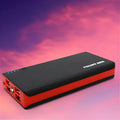 Blue 20000mAh portable power bank with USB port, shown next to a mobile phone for scale.
