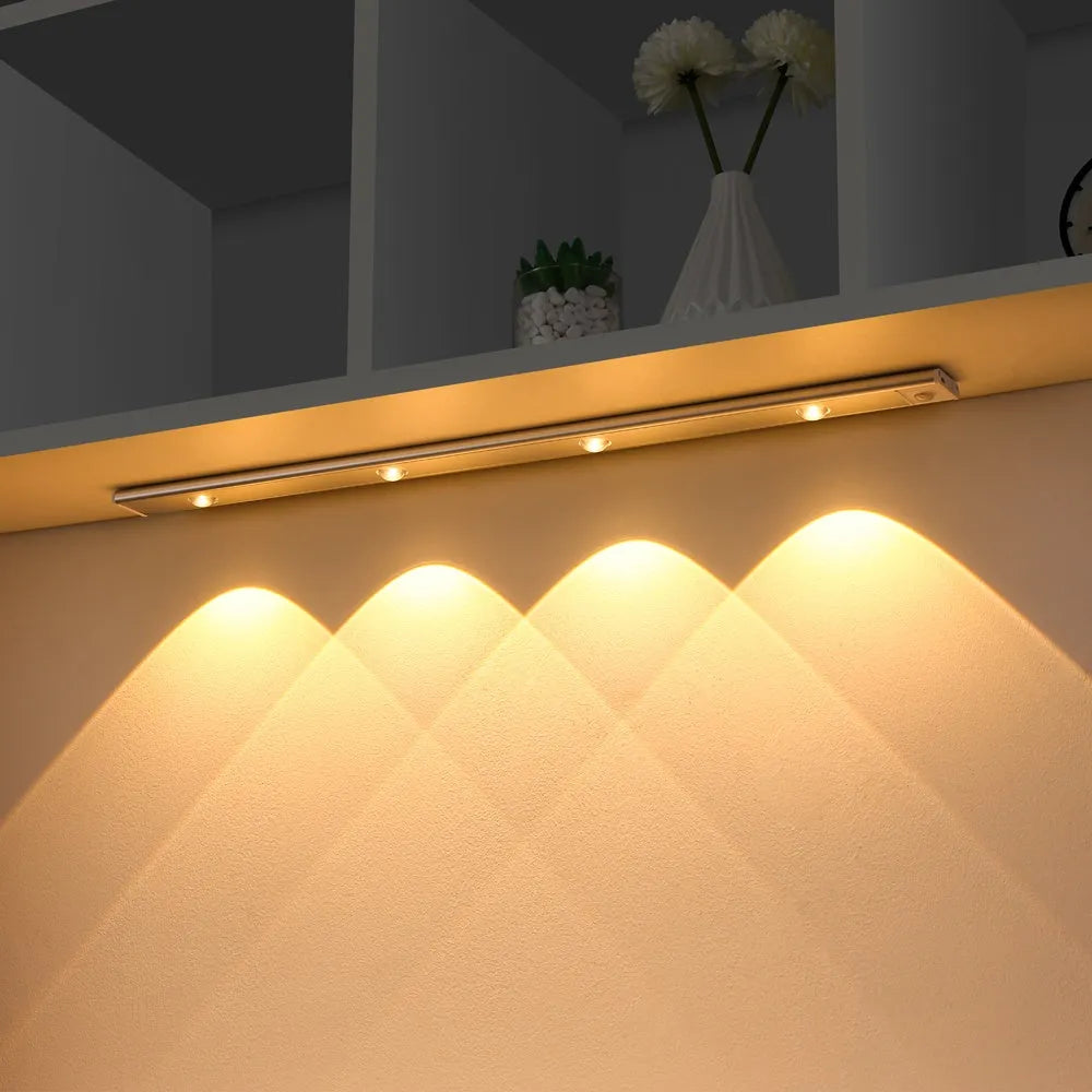 Silver ultra-thin USB rechargeable LED light strip with motion sensor for cabinet mounting.