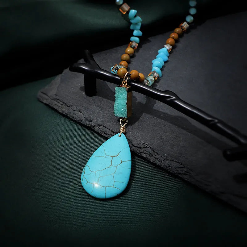 Blue turquoise imitation mineral necklace with large water drop pendant and ball bead chain.