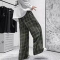 Men's black and green plaid loose fit straight leg trousers with mid waist design