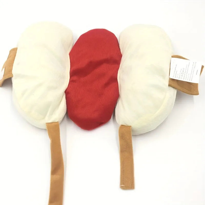 A small dog wearing a red and brown plush hot dog costume with a hood and leg openings.
