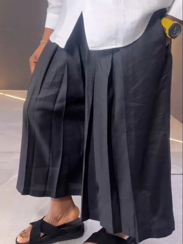 Women's white asymmetrical front long sleeve shirt with black pleated trousers casual set