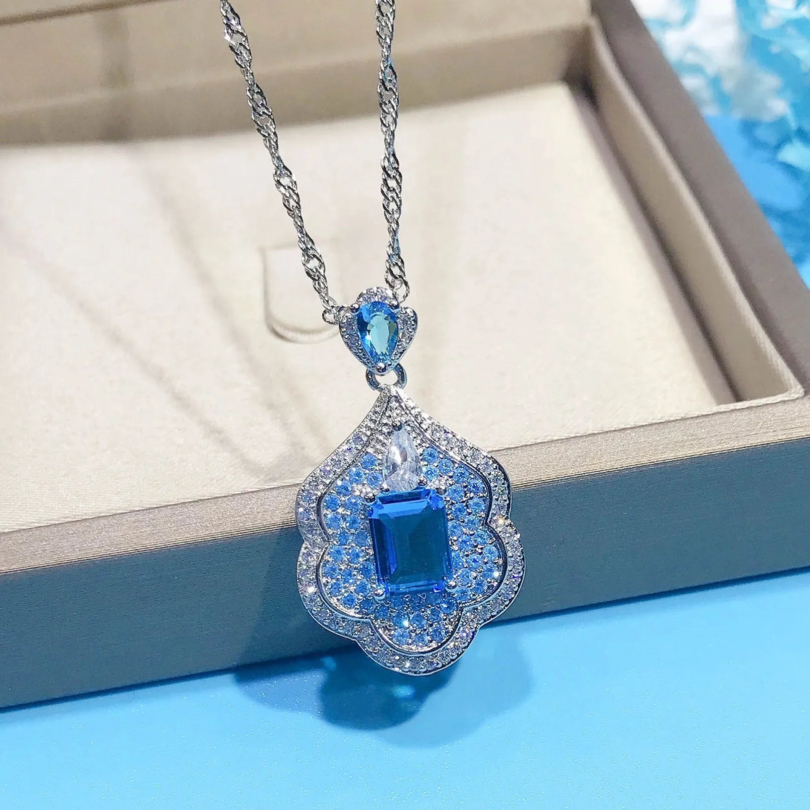 Sea blue geometric copper pendant with aquamarine topaz sky mirror appearance