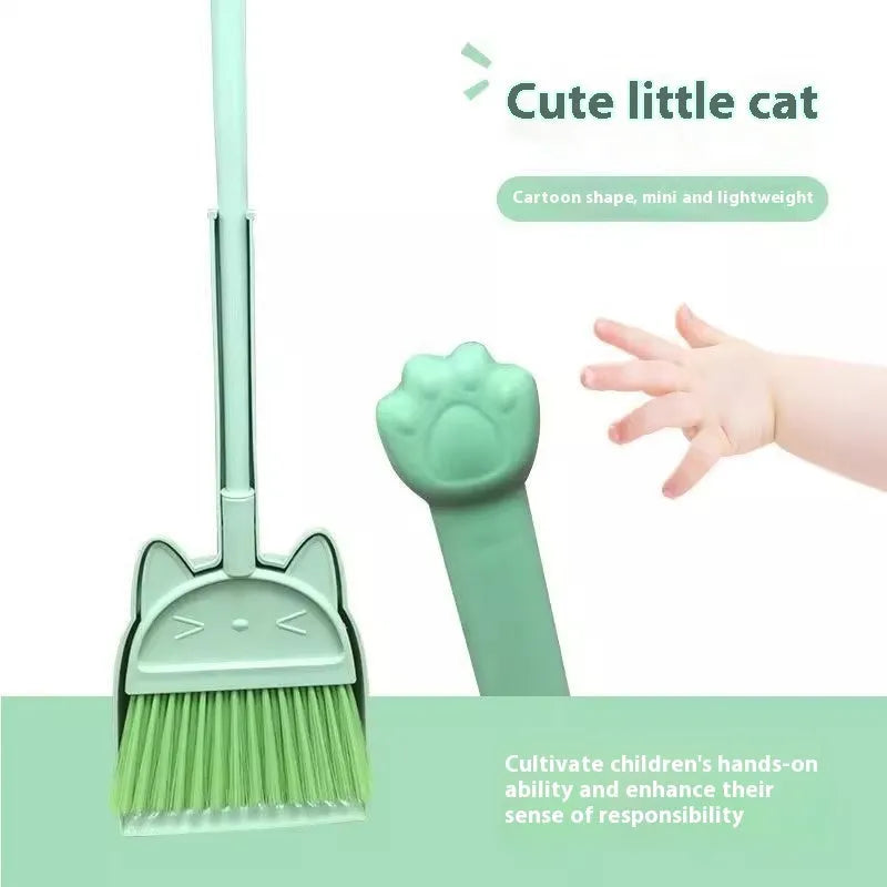 Purple plastic broom and dustpan set with a rotating brush holder on a wooden floor.