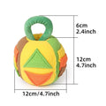 Green and pink plush squeaky ball dog toy with treat pockets on a white background