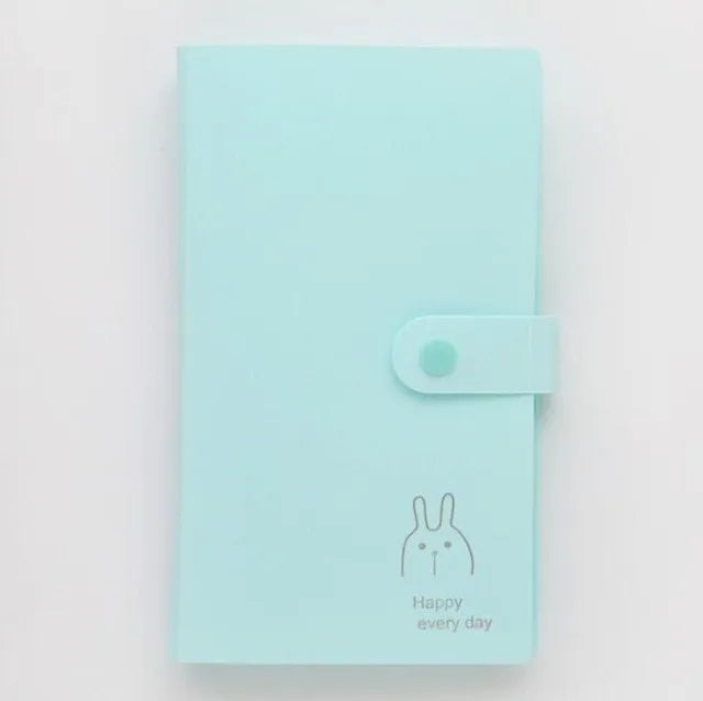 Blue PVC and PP business card holder book with protective shell and smile logo, showing insert pocket.