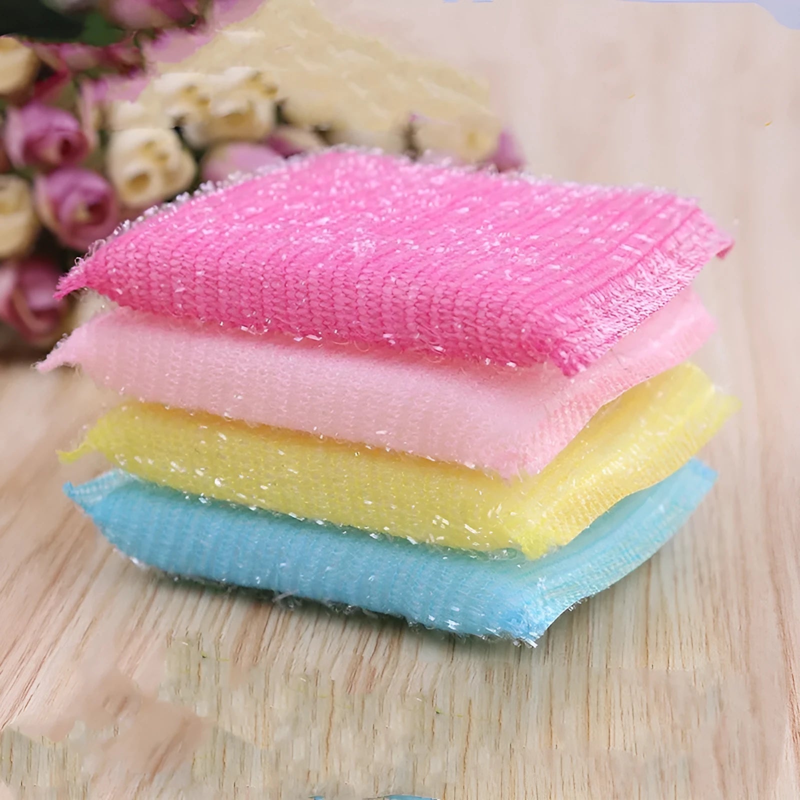Macaron coloured pinstripe fabric sponge dish mop shown on a kitchen surface.