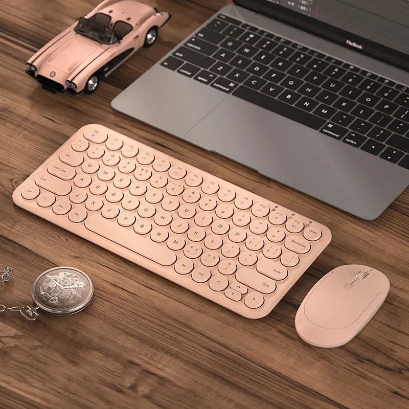 Mute white ultra-thin wireless keyboard and mouse with tiny USB receiver on a wooden desk