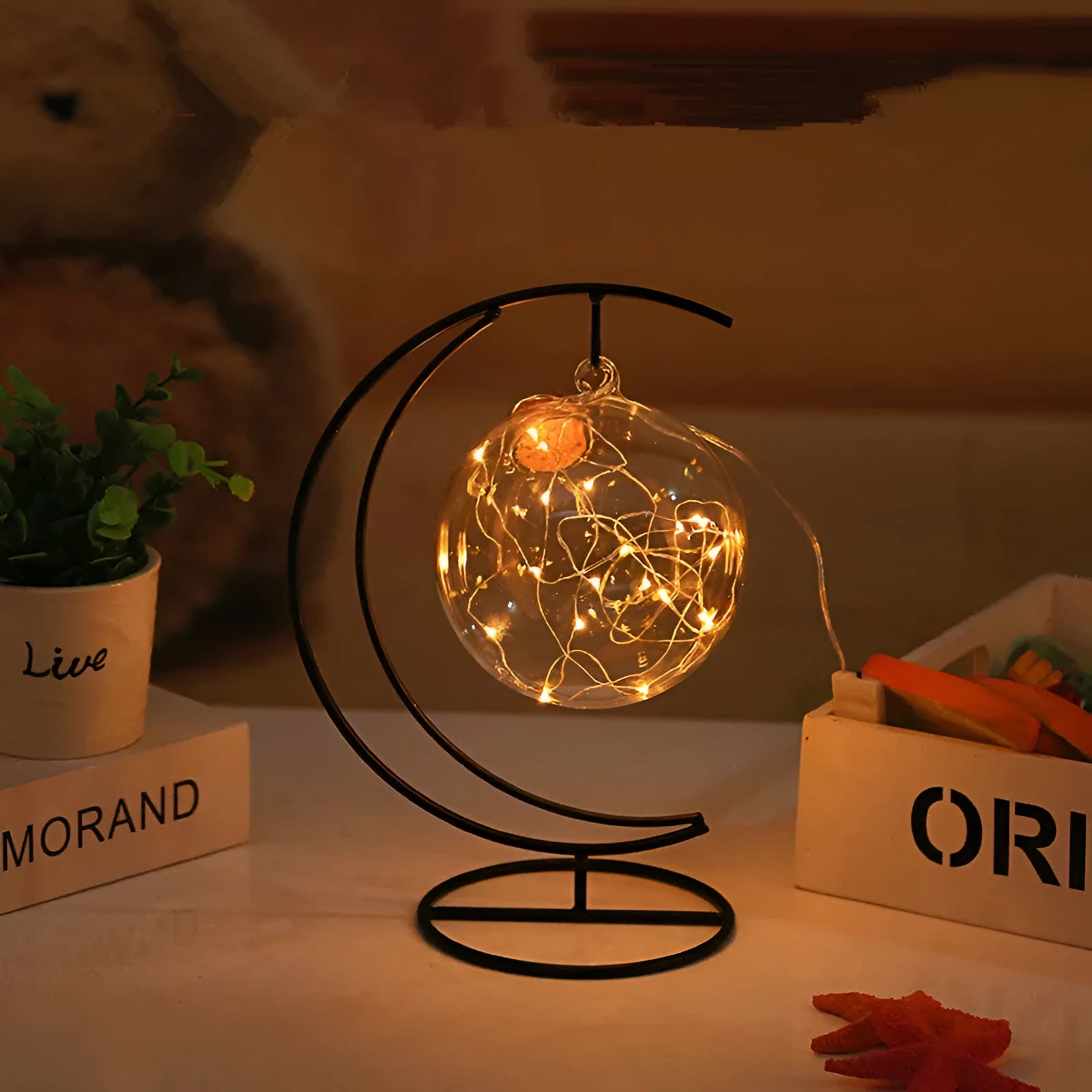 Round glass wish bottle with cork, 12 cm diameter, containing a warm white LED light strand with 20 lamp beads and folded paper stars