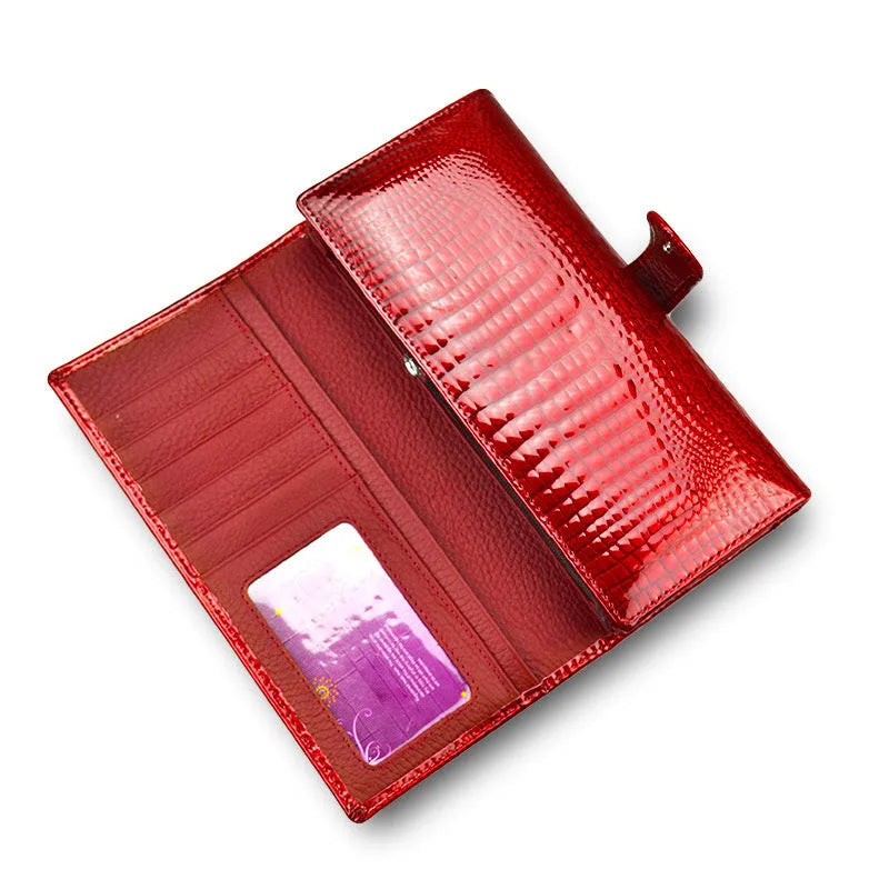 Red women's leather coin purse with a crocodile pattern texture and pigskin lining.