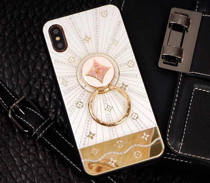 Gold-plated diamond ring adhesive phone stand grip mounted on iPhone