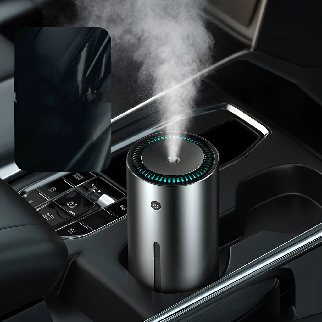 Black aluminium alloy car humidifier with USB cable and 12V car adapter plug on a desk.