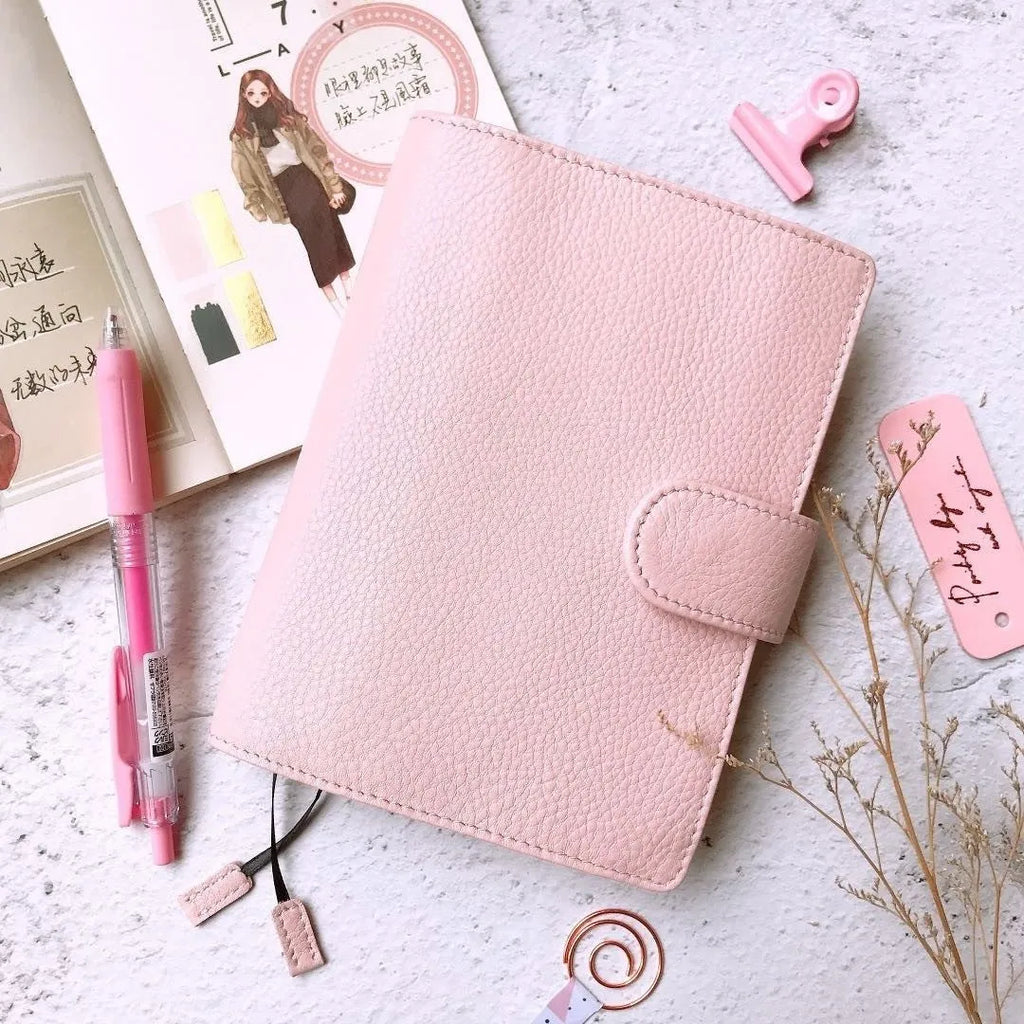 A6 loose-leaf diary with cowhide leather cover showing lychee pattern texture