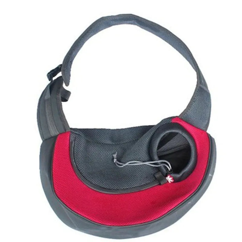 Blue pet carrier backpack for a small dog, showing padded interior and shoulder straps.