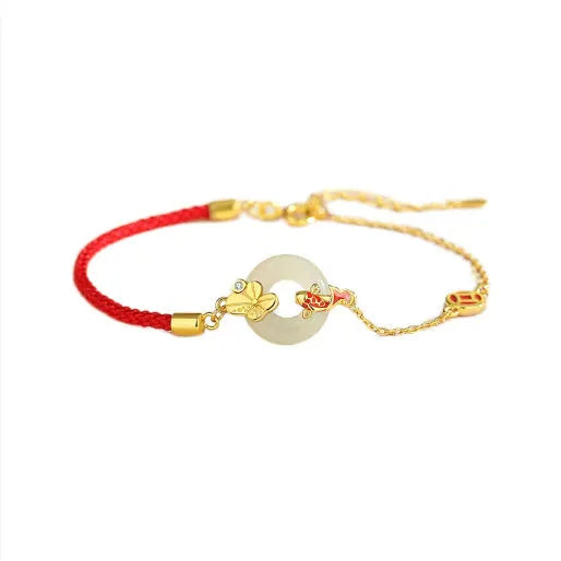 Gold-colour Koi fish charm bracelet in 925 silver with a red rope and peace buckle safety clasp.