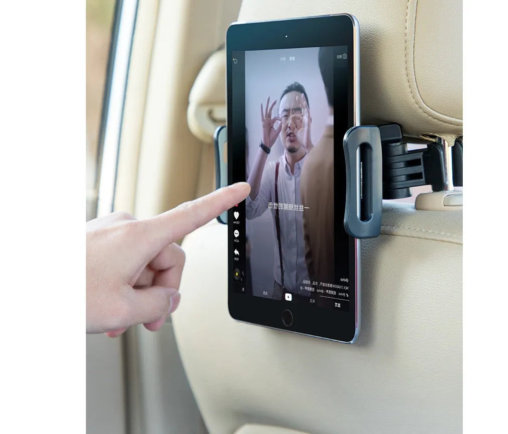 Black universal car phone holder mounted on vehicle rear seat base holding tablet