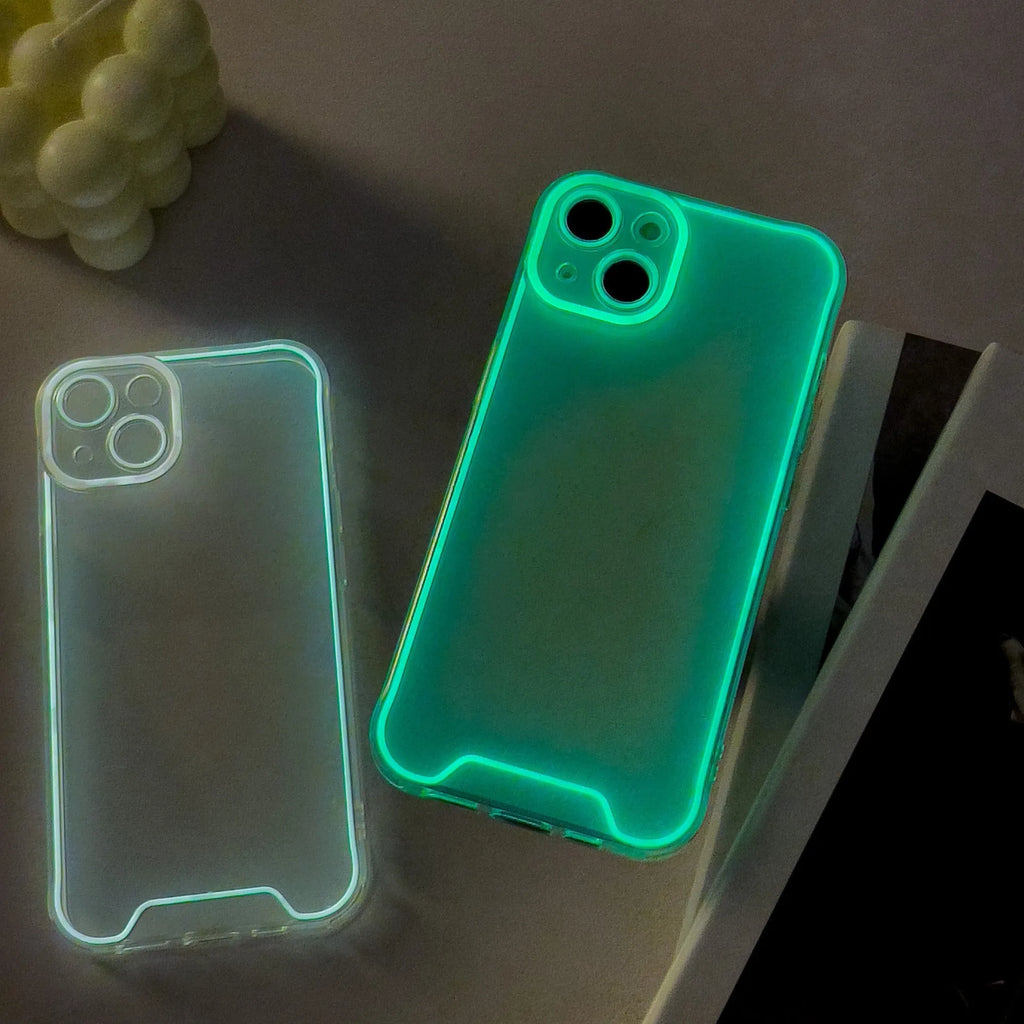 Glow in the dark soft TPU phone case for iPhone on a dark background, showing luminescent green colour.