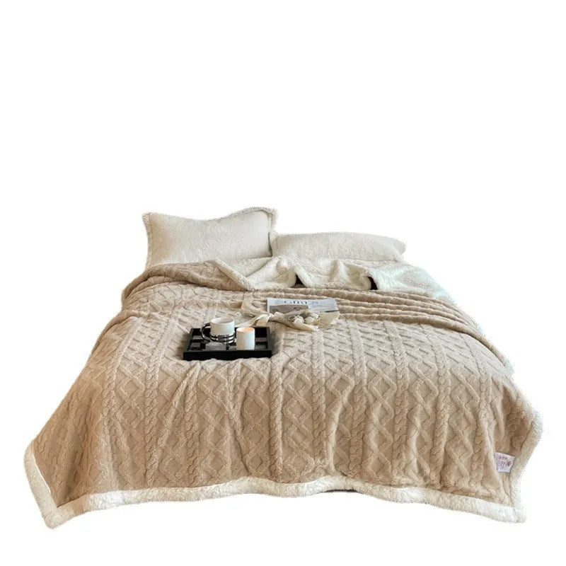 Polyester winter thermal flannel blanket in beige, laid flat showing its texture and simple modern style.