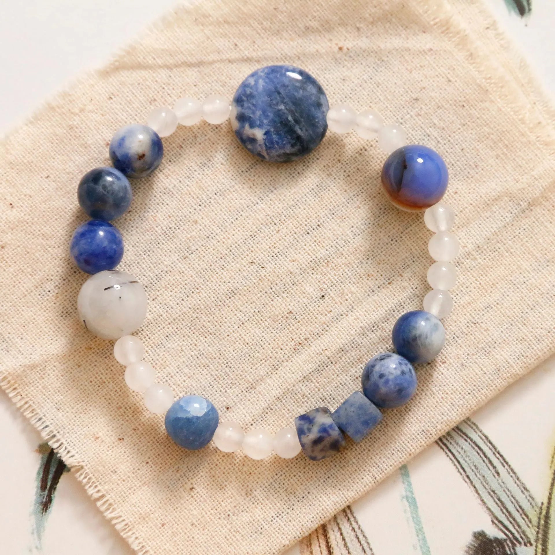 Hand-woven natural stone bracelet with blue point and black hair crystal agate beads