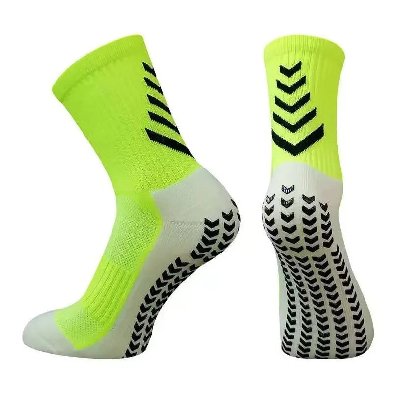 Men's black and green mid-calf athletic socks with a geometric pattern and non-slip silicone grip.