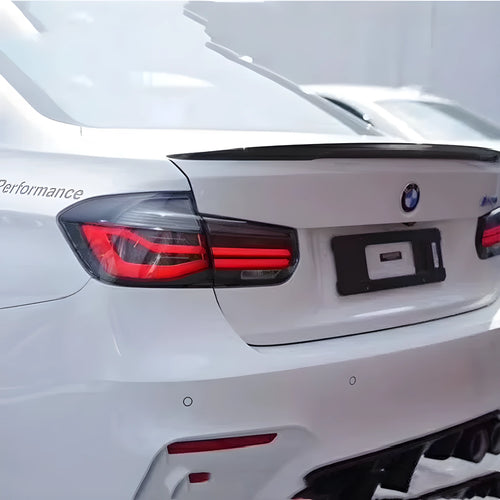BMW 3 Series tail light assembly with streamer steering LED running lights in black smoke finish