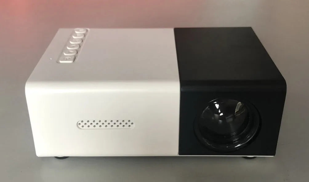Compact black HD 1080P mini digital projector with UK power plug on white background