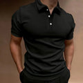 Man modelling a loose fit grey cotton blend short sleeve t-shirt.