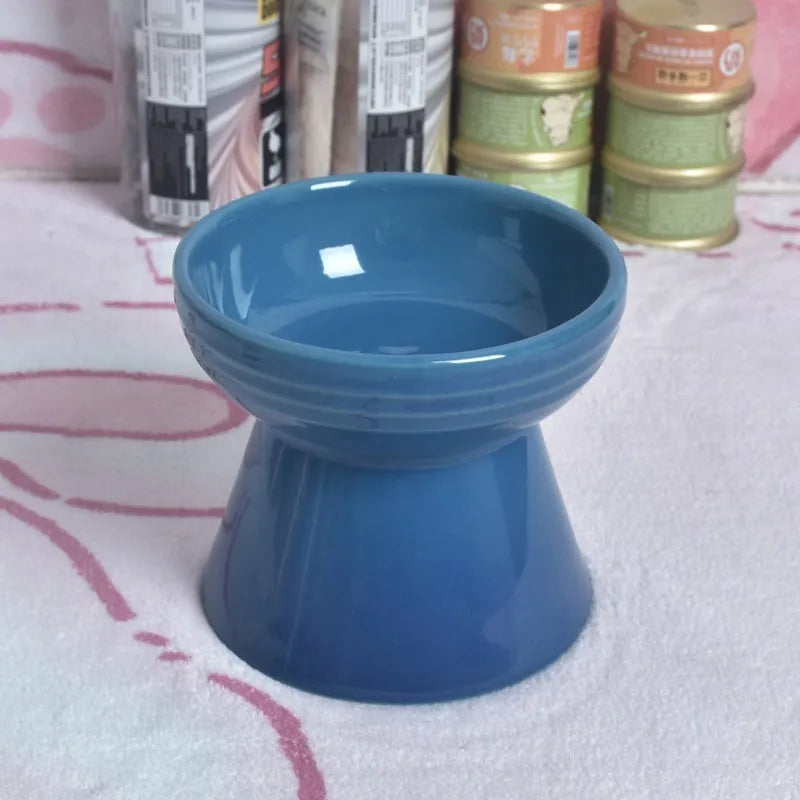 White ceramic pet bowl with a high foot neck and slanted rim for cat or dog feeding