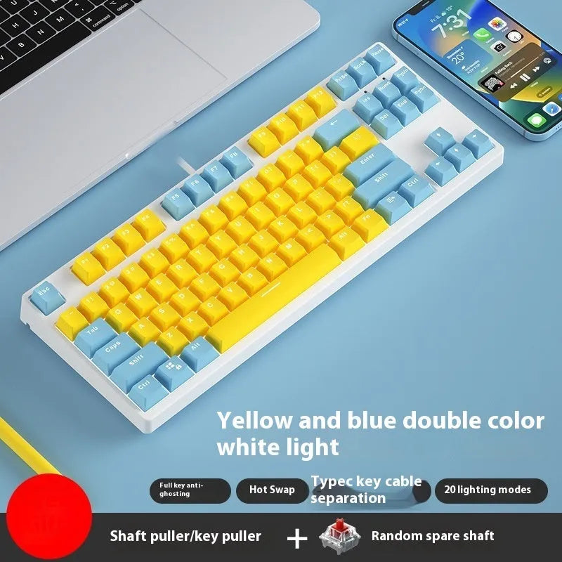 87-key wired mechanical keyboard with two-tone keycaps, shown with switch puller and cleaning brush