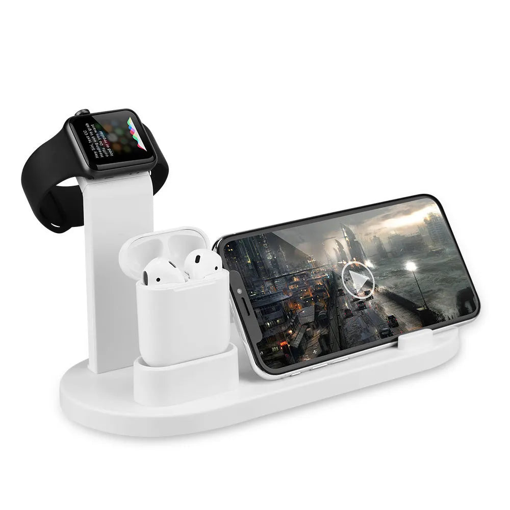 White or black plastic headphone charging stand with a USB port for phones.