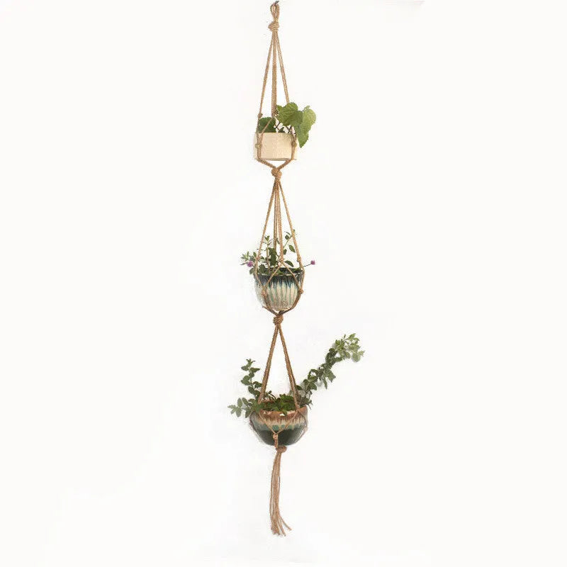 A rustic-style woven cotton rope plant trellis panel supporting green leaves.