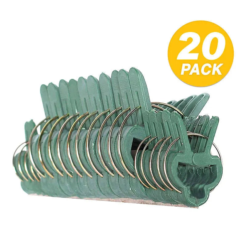 Green plastic and zinc plant fixing clips in large and small sizes for securing climbing plants.