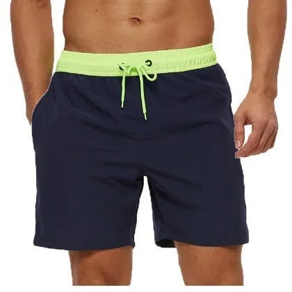 Men's blue fitness shorts with a drawstring waistband and a side zipper pocket.