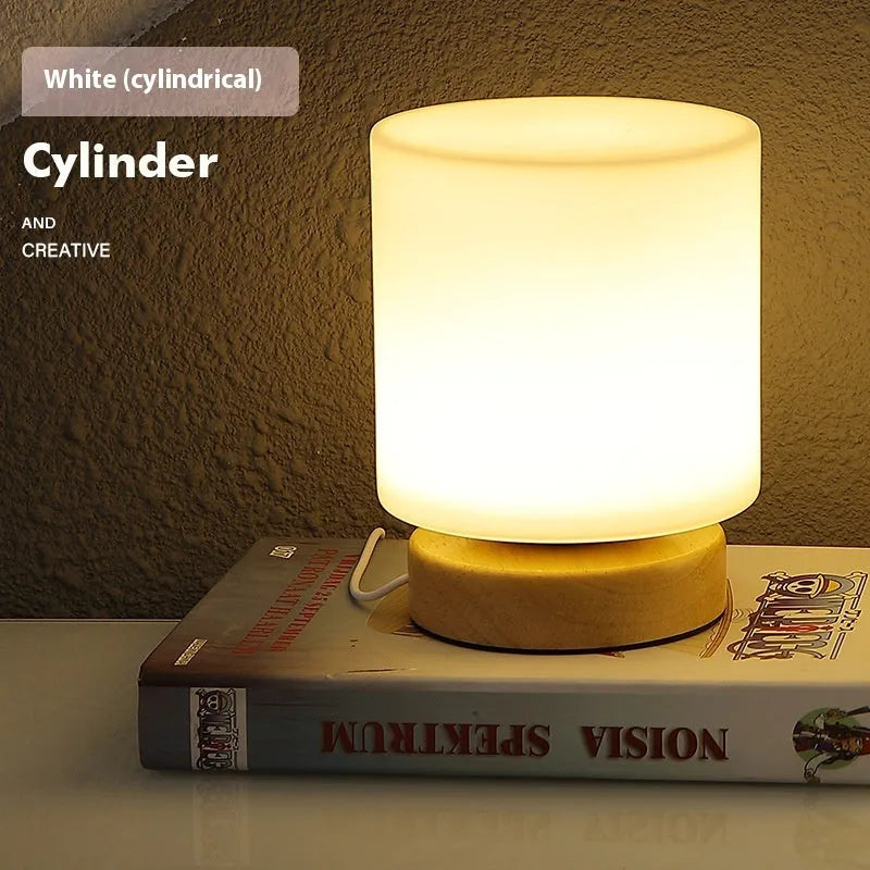 Nordic solid wood base USB table lamp in a choice of cube, column, cylinder, or ball shapes with touch dimming.