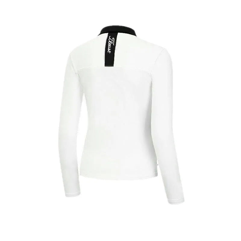 Women's black golf top with long sleeves for sun protection during outdoor activities