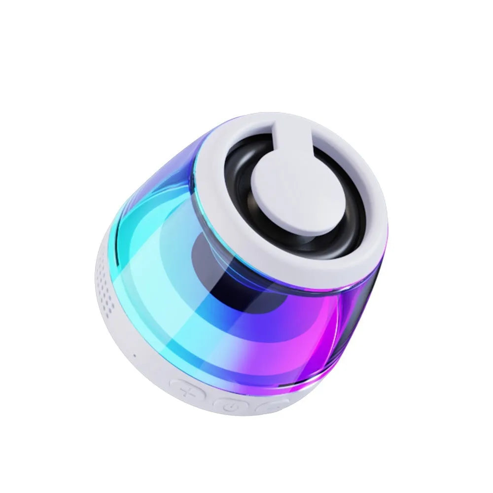 Portable white Bluetooth speaker with magnetic base, mood light, and card slot on a desk.