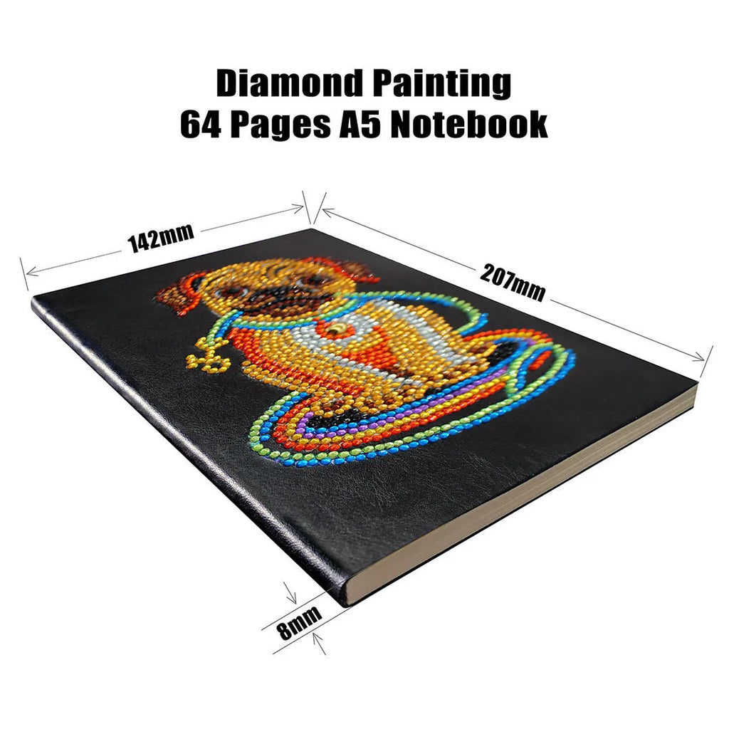 Black A5 hardcover diamond painting notebook with elastic closure, shown closed and open on a crafting table.