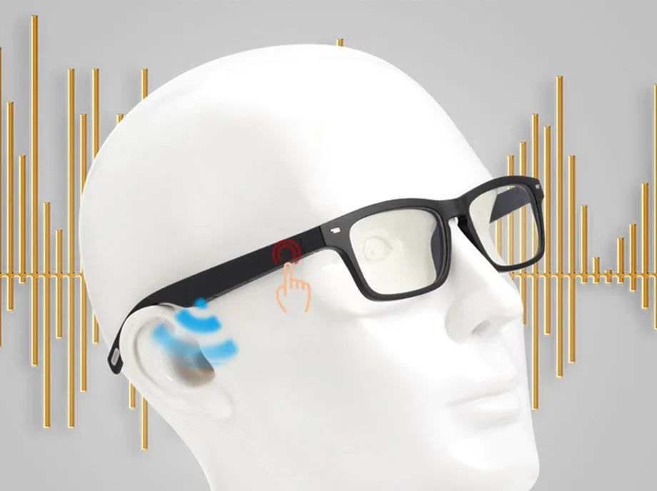 Smart Bluetooth audio glasses with dark lenses on a table, showing temple speakers and a charging case.