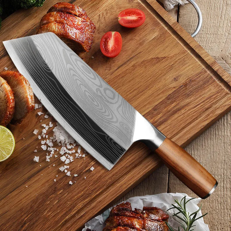 A stainless steel kitchen knife with a 320mm blade on a kitchen counter.