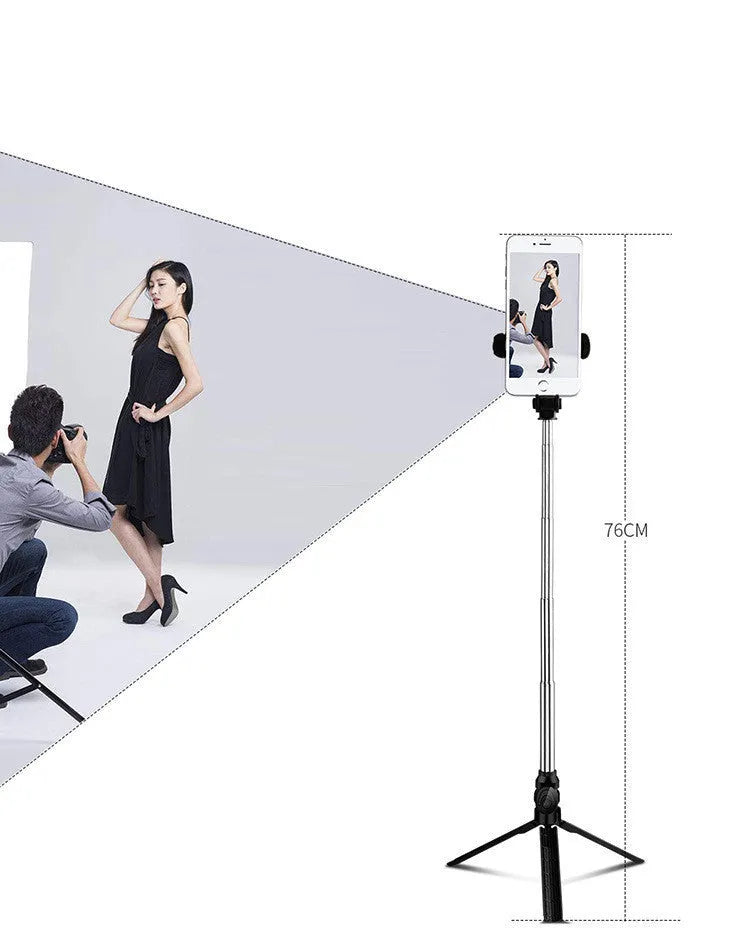 Compact black aluminium Bluetooth selfie stick with integrated tripod legs and a 360-degree rotating phone clip.
